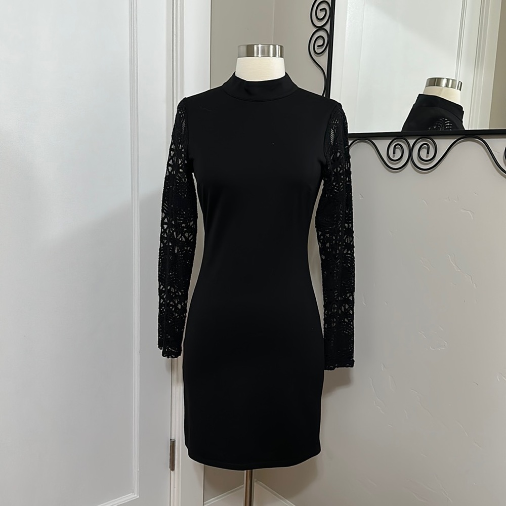 Black Lulu’s zip up turtleneck dress with sheer sleeves